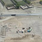 Photo showing the construction site of Hojajullah Jalal Foundation's CHC Clinic in Ghazni, with workers busy constructing the building structure.